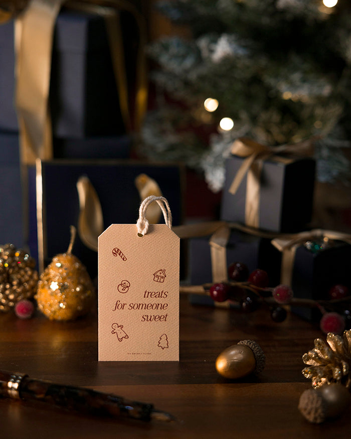 My Brunch Plans' gift tag with text 'treats for someone sweet' on a festive background with Christmas decorations.