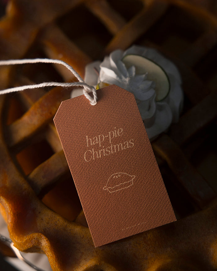 My Brunch Plans' gift tag with 'hap-pie Christmas' text and a pie illustration on an apple pie.