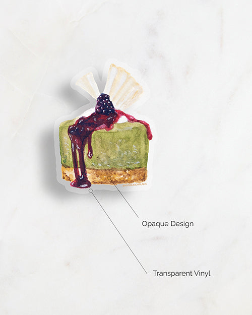 a diagram of My Brunch Plans’ hand painted gouache matcha cheesecake with blackberry compote and white chocolate topper diecut vinyl sticker showing the design is opaque printed on a matte transparent waterproof vinyl.