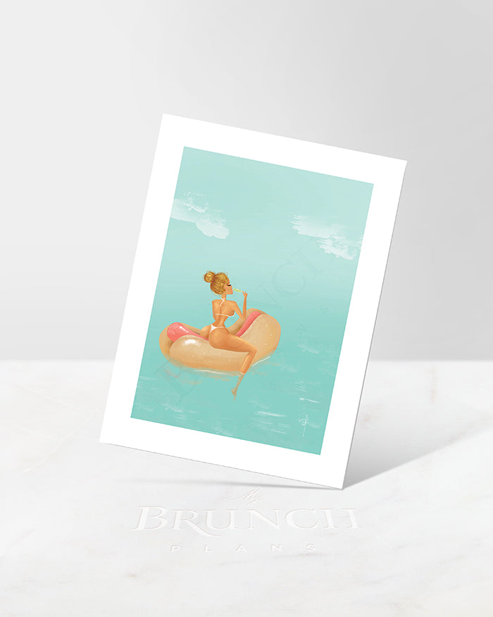 A summer-themed art print featuring an illustration of a person in a bikini on a pool float, with a lighthearted and colorful aesthetic.