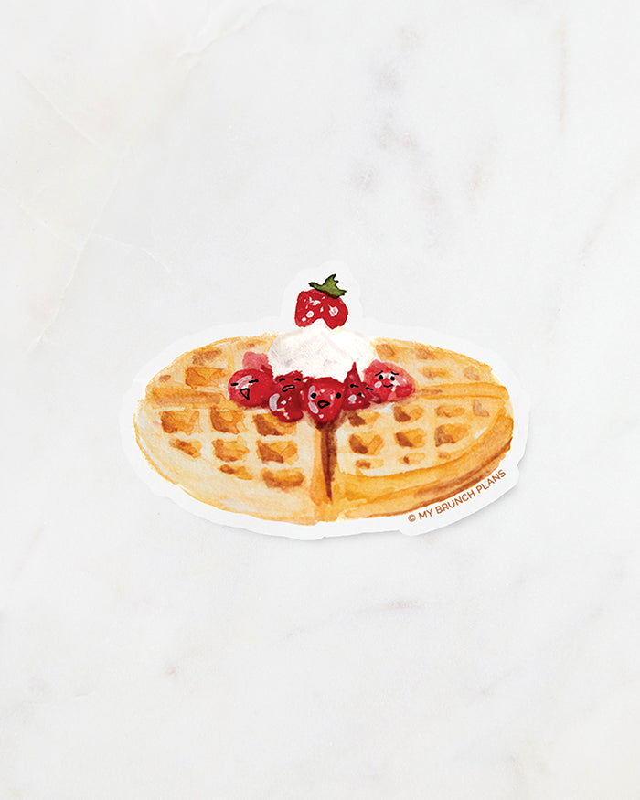 My Brunch Plans' hand painted in gouache American Waffle with smiley strawberries and cream diecut sticker with the paper backing on a marble background.