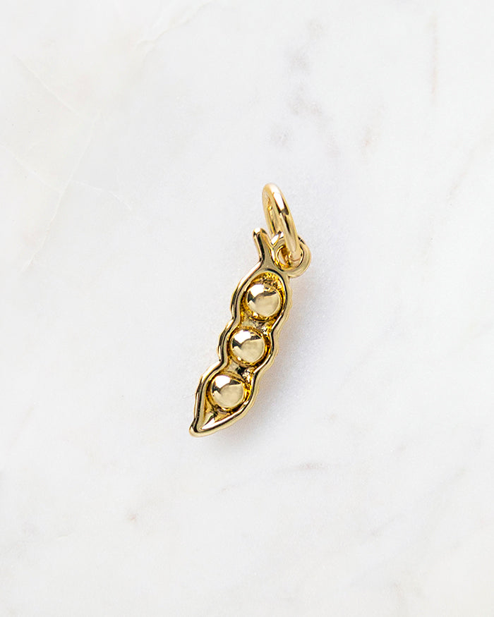 My Brunch Plans' Peas in a Pod Charm | 18k Gold Plated on a marble background, perfect for planners, notebooks and more.