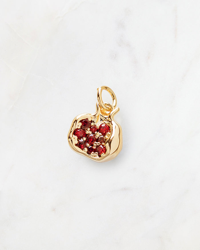 My Brunch Plans' Gold Pomegranate Charm | 16k Gold Plated on a marble background, perfect for planners, notebooks and more.