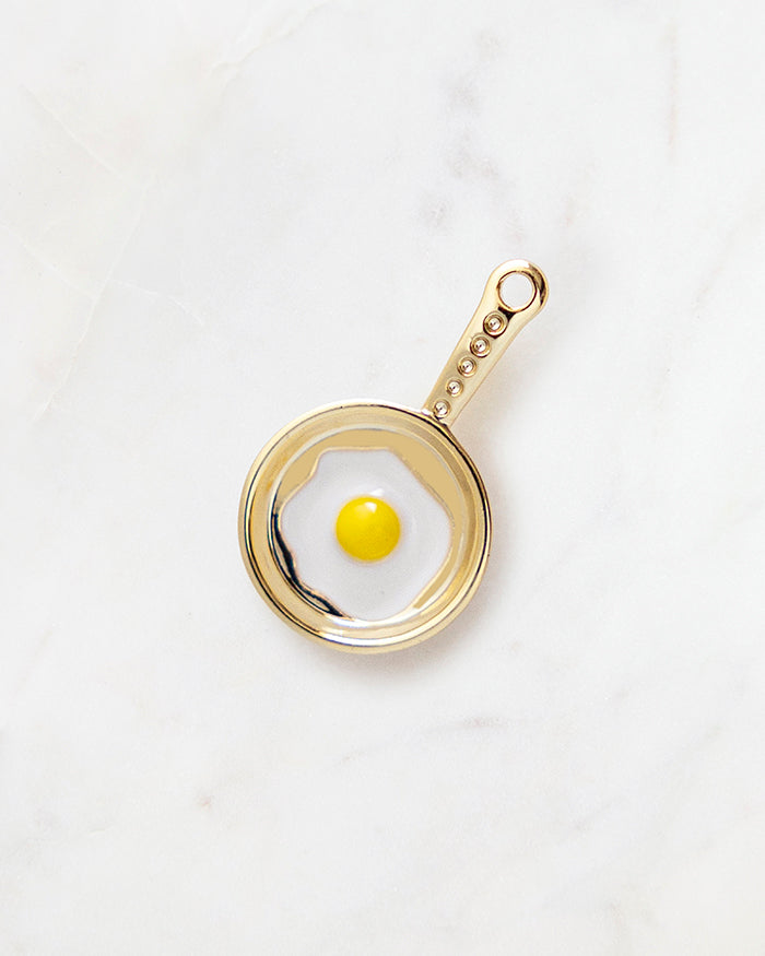 My Brunch Plans' Egg Skillet Charm | 18k Gold Plated with Enamel on a marble background, perfect for planners, notebooks and more.