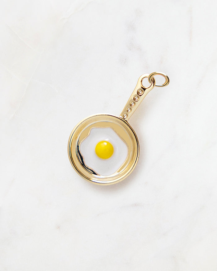 My Brunch Plans' Egg Skillet Charm | 18k Gold Plated with Enamel on a marble background, perfect for planners, notebooks and more.