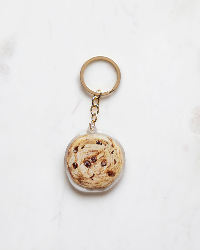 My Brunch Plans' hand painted gouache  epoxy resin Chocolate Chip Keychain on a marble background.