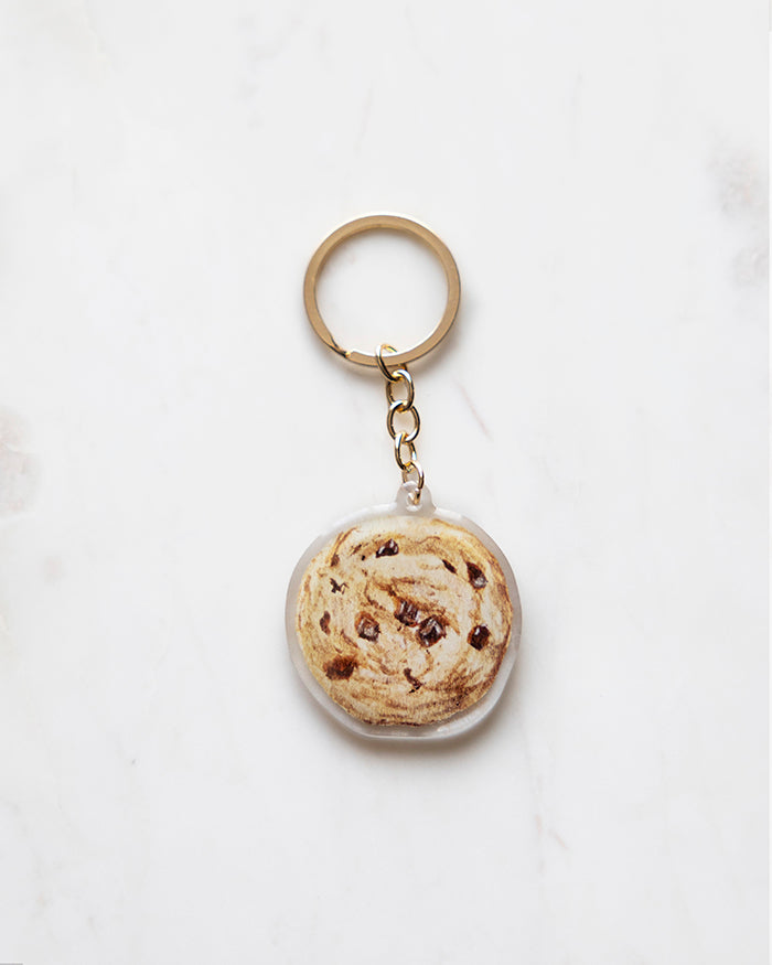 My Brunch Plans' hand painted gouache  epoxy resin Chocolate Chip Keychain on a marble background.