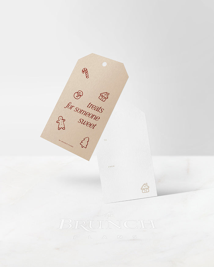 My Brunch Plans’ gift tag on a white background. Front Design features "treats for someone sweet" with a hand drawn line art of christmas cookies. Back design features a writing area with “to” and “from” and a hand drawn line art gingerbread house.