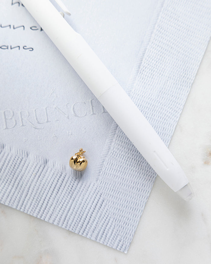 Bell Pepper Charm | 18k Gold Plated on My Brunch Plans’ Napkin notepad with a pen for size comparison.